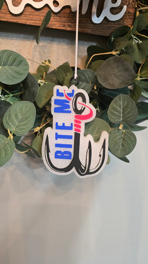Handmade fishing hook-shaped car freshie featuring the phrase "Bite Me," designed as a fun scented rearview mirror accessory for fishing enthusiasts.