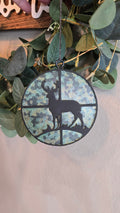 Handmade round deer car freshie featuring a black buck silhouette against a stained-glass camouflage background with a hanging loop.
